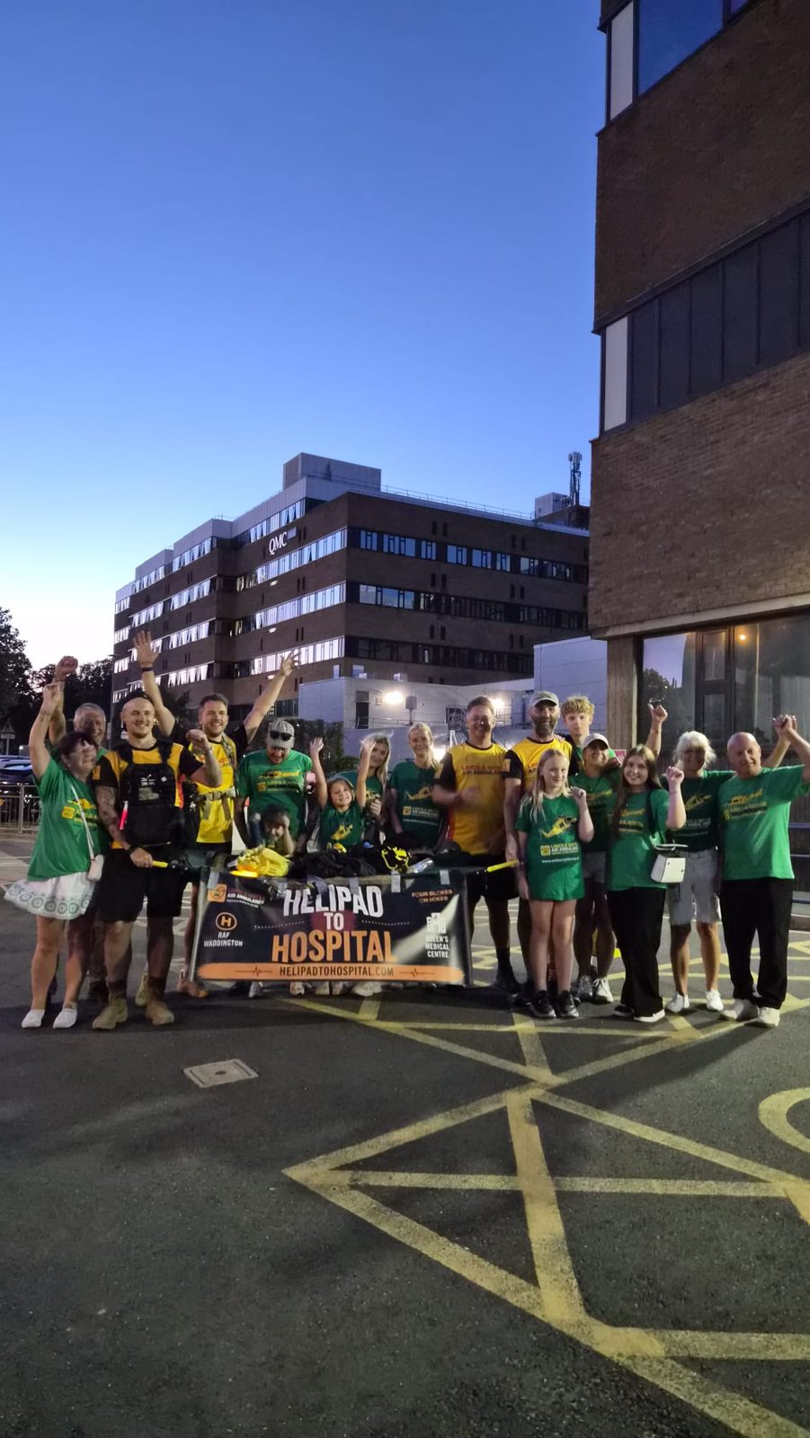 Arms up at the finish with family and supporters